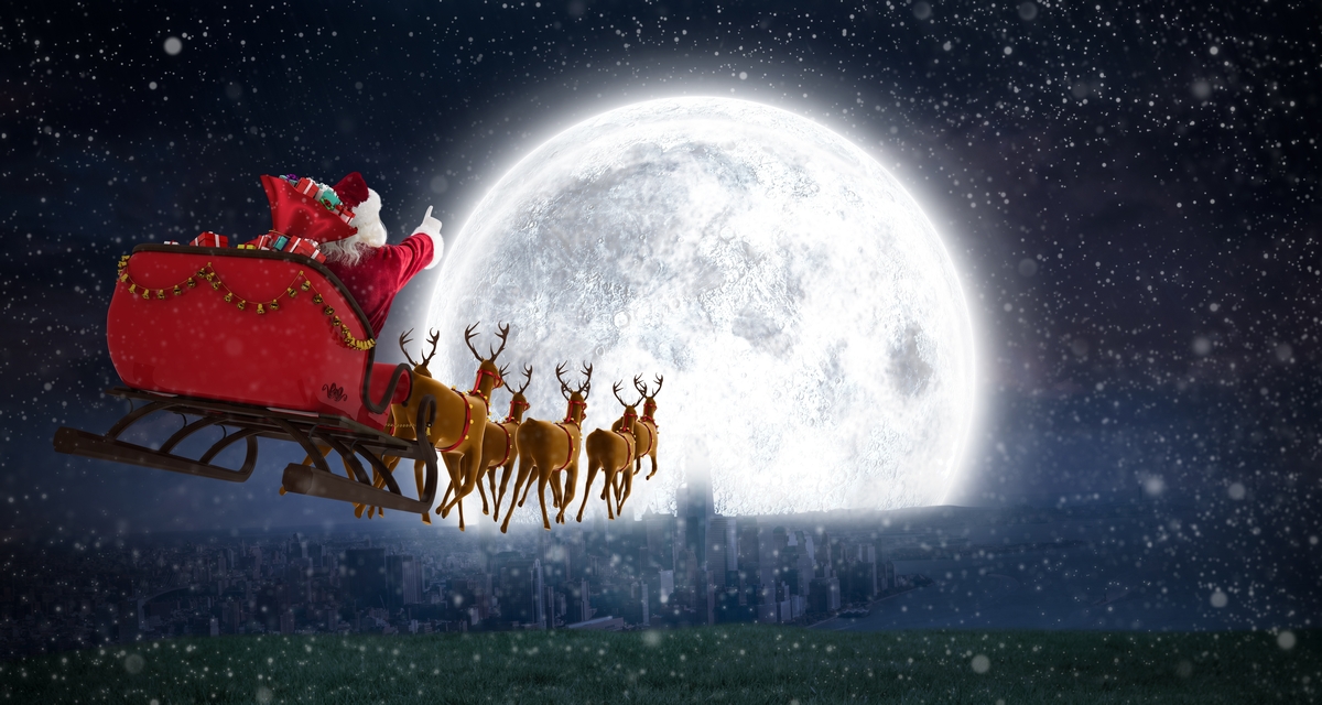 Santa Claus flying to the Moon with presents (Image)